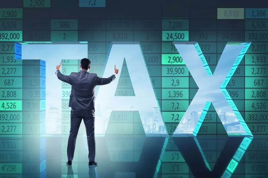 Businessperson facing large TAX letters over financial data