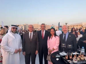 Group of guests posing together at an outdoor reception