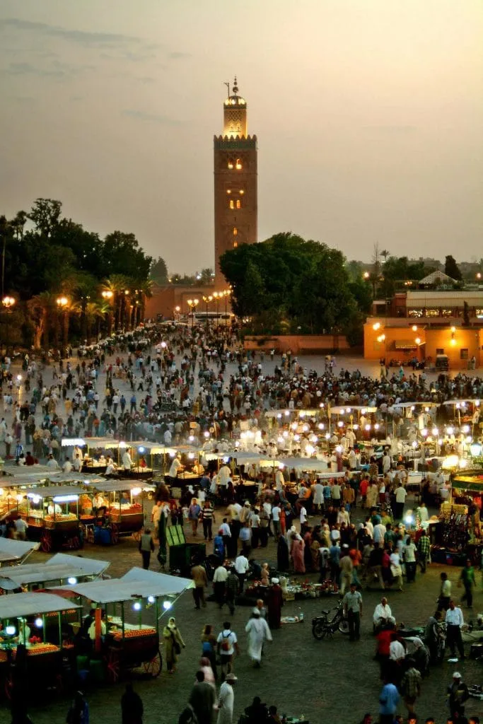 Family arriving with luggage outside a home in Marrakech