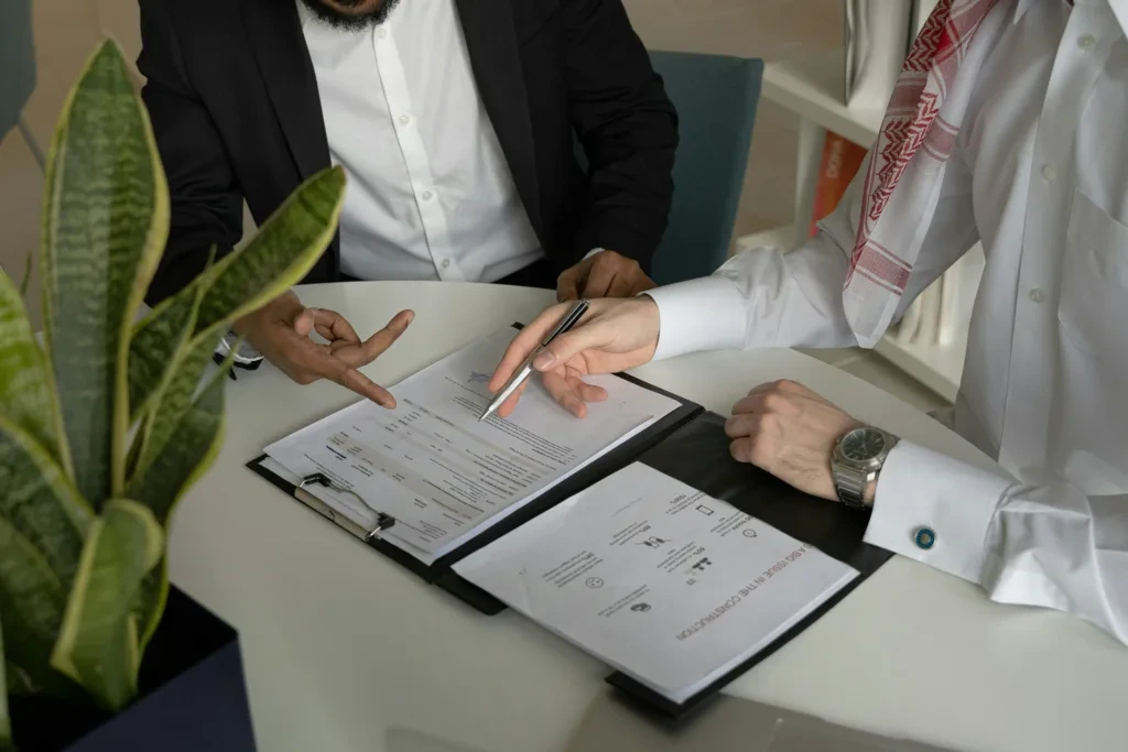 A notary reviewing property transaction documents with a client