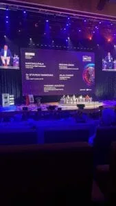 DeepTech Summit stage with speakers and presentation screens