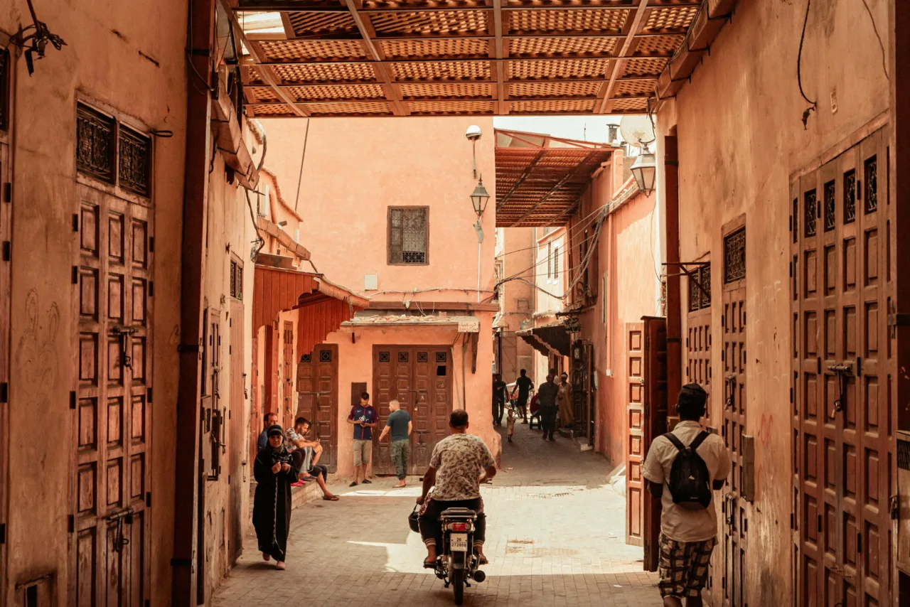 Traditional neighborhood in Marrakech showcasing historic architecture and narrow streets, ideal for neighborhoods to buy a property in Marrakech.