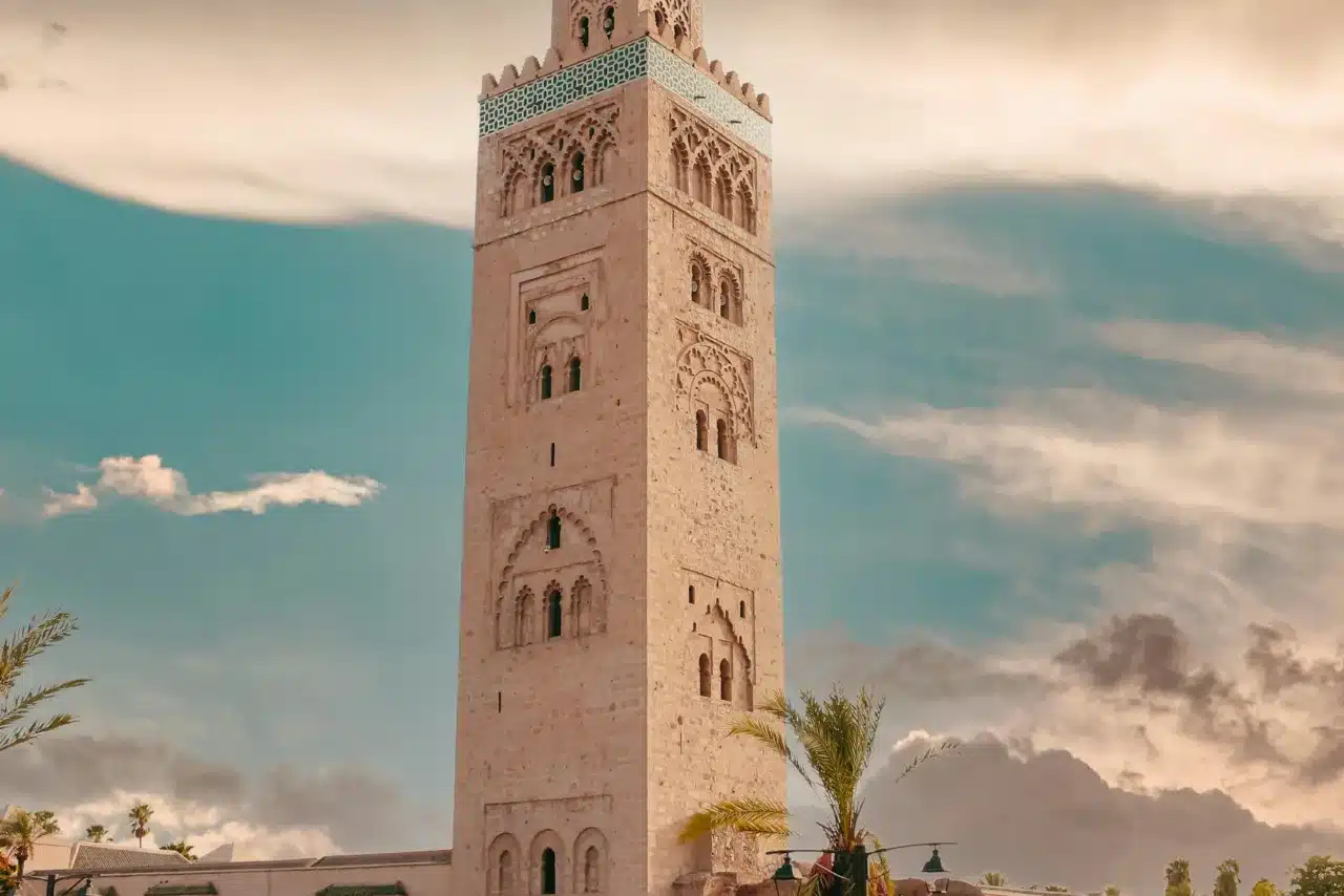 View of Koutoubia Mosque surrounded by the Marrakech real estate market and bustling city life